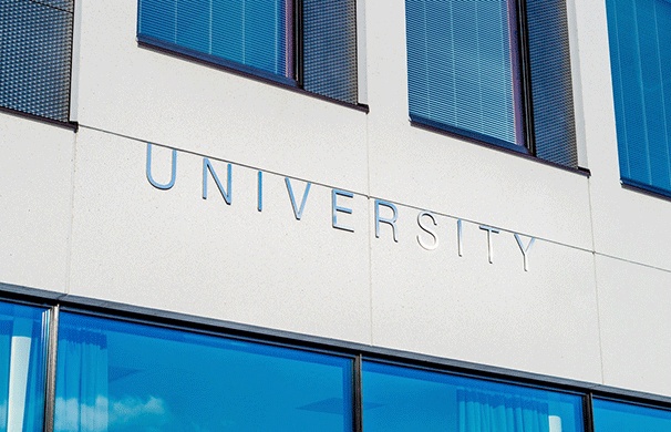 Close up of a building with a sign that reads "University."